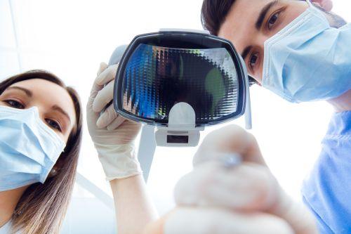 dentist with dental light | sedation dentistry medina ohio