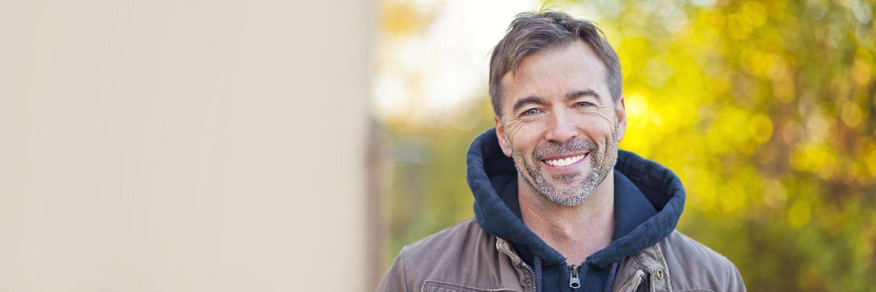 man in sweatshirt smiling | dentist medina oh